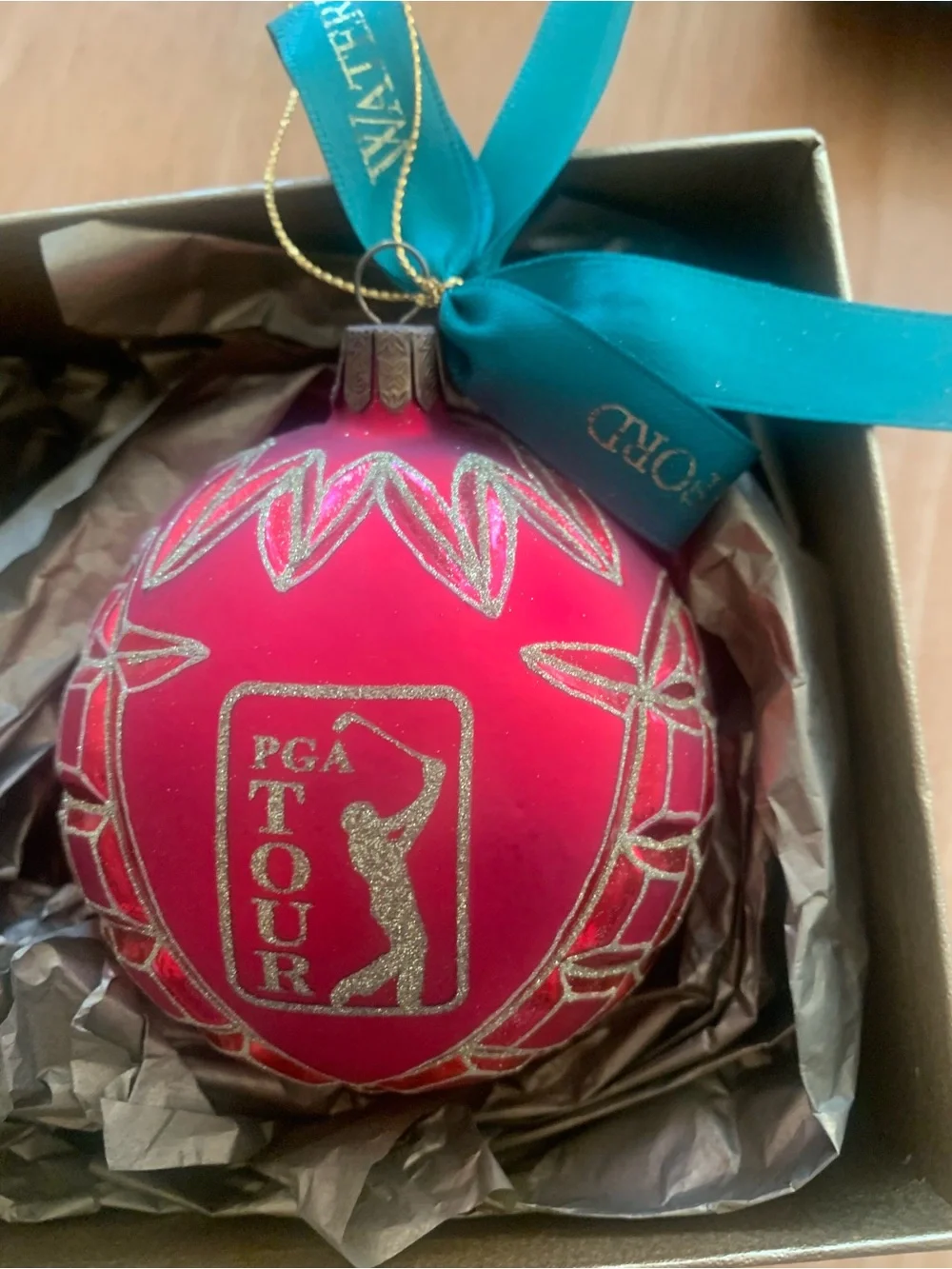 Waterford Red Glass Ornament with Gold Glitter Accents with PGA Logo.